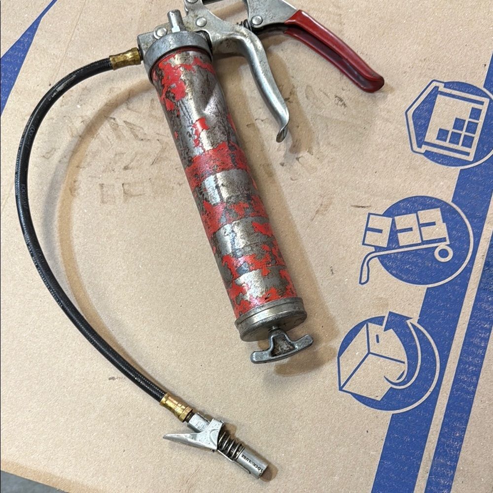 Red and Silver Grease Gun